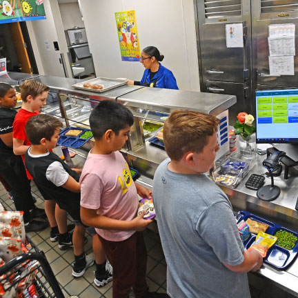 CHildren getting lunch in a cafeteria